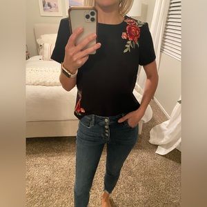 Black shirt with floral embroidery detail